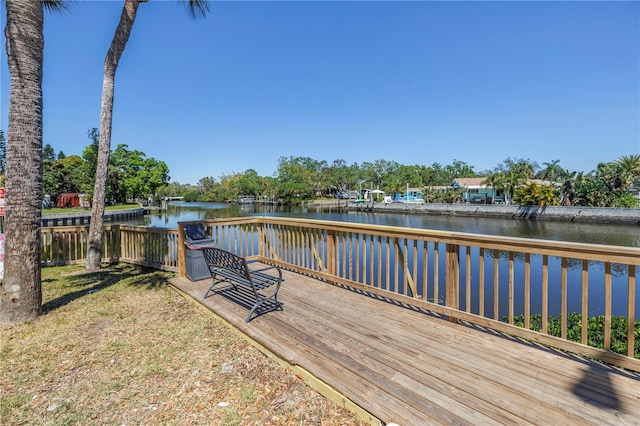 9105 W Hillsborough Ave Unit I102, Tampa, FL 33615 - wooden deck with a water view