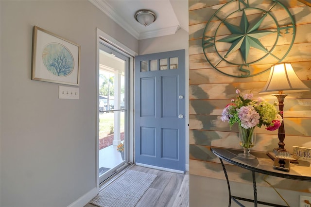 8326 Archwood Cir, Tampa, FL 33615 - entryway with baseboards, wood finished floors, and ornamental molding