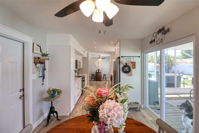 8326 Archwood Cir, Tampa, FL 33615 - dining area featuring light wood-style flooring, ceiling fan, and recessed lighting