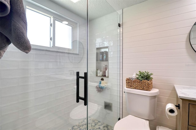 8326 Archwood Cir, Tampa, FL 33615 - full bath with toilet, vanity, a textured ceiling, and a shower stall