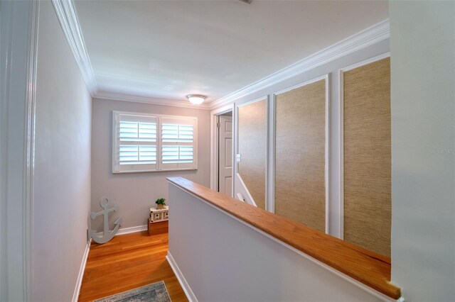 8326 Archwood Cir, Tampa, FL 33615 - corridor with baseboards, an upstairs landing, wood finished floors, and crown molding