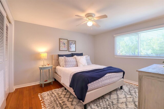 8326 Archwood Cir, Tampa, FL 33615 - bedroom featuring a closet, baseboards, ceiling fan, and wood finished floors