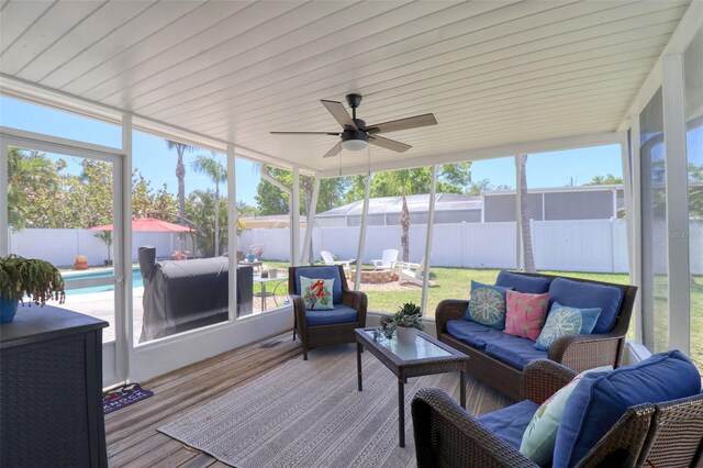 8326 Archwood Cir, Tampa, FL 33615 - sunroom featuring an outdoor living space with a fire pit and a ceiling fan