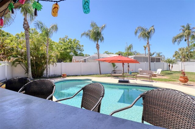 8326 Archwood Cir, Tampa, FL 33615 - view of swimming pool featuring a fenced in pool, a fenced backyard, and a patio area