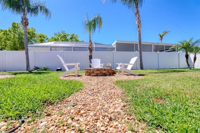 8326 Archwood Cir, Tampa, FL 33615 - view of yard featuring a fenced backyard and an outdoor fire pit