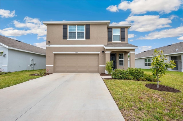 traditional home with stucco siding, an attached garage, a front lawn, and concrete driveway