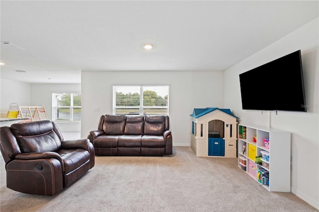 carpeted living room with baseboards and recessed lighting