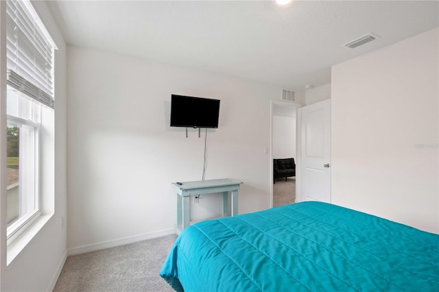 bedroom with carpet, baseboards, and visible vents