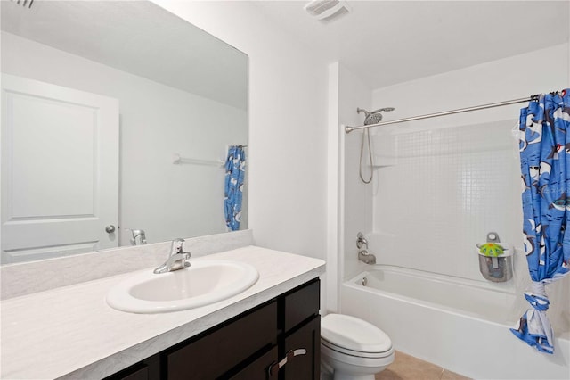 bathroom featuring visible vents, toilet, tile patterned floors, vanity, and shower / bath combination with curtain