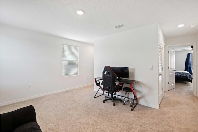 office area with baseboards, visible vents, recessed lighting, and light colored carpet