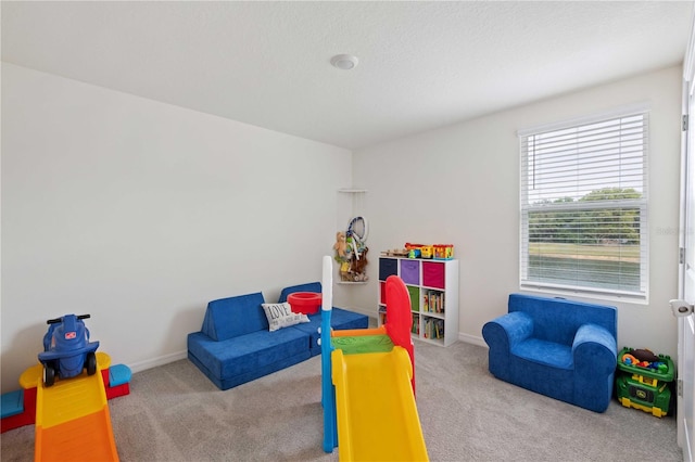 game room featuring baseboards and carpet