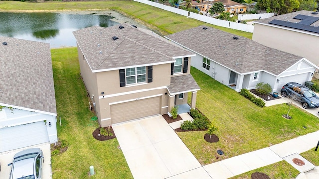 birds eye view of property with a water view