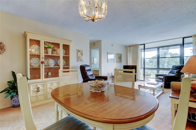 14130 Rosemary Ln Unit 3312, Largo, FL 33774 - carpeted dining area featuring expansive windows, a chandelier, and a textured ceiling