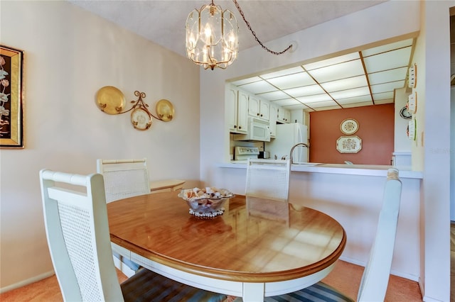 14130 Rosemary Ln Unit 3312, Largo, FL 33774 - dining area with light colored carpet and a chandelier