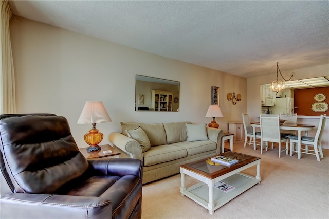 14130 Rosemary Ln Unit 3312, Largo, FL 33774 - living room featuring a textured ceiling, a chandelier, and light carpet