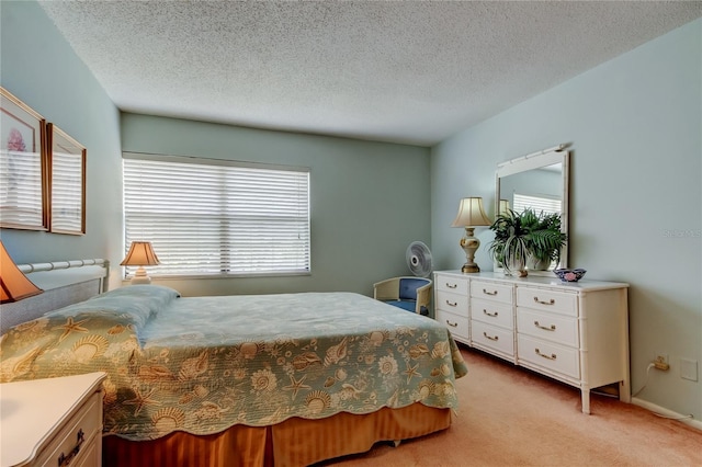 14130 Rosemary Ln Unit 3312, Largo, FL 33774 - bedroom with light carpet and a textured ceiling