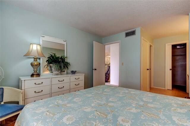14130 Rosemary Ln Unit 3312, Largo, FL 33774 - tiled bedroom with a textured ceiling and visible vents