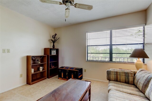 14130 Rosemary Ln Unit 3312, Largo, FL 33774 - living room with a ceiling fan, tile patterned floors, a healthy amount of sunlight, and a textured ceiling