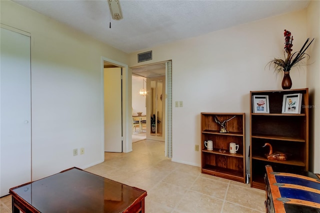 14130 Rosemary Ln Unit 3312, Largo, FL 33774 - sitting room with baseboards, a notable chandelier, visible vents, and light tile patterned floors