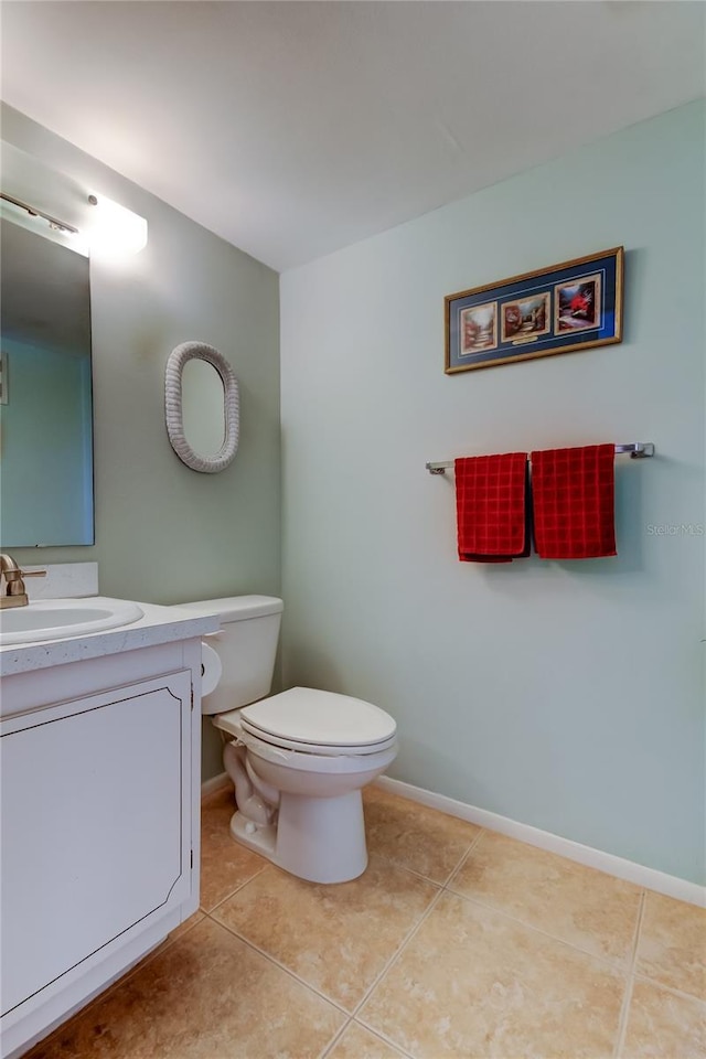 14130 Rosemary Ln Unit 3312, Largo, FL 33774 - bathroom featuring toilet, vanity, baseboards, and tile patterned flooring