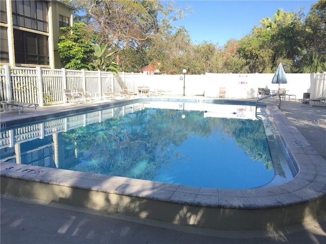 14130 Rosemary Ln Unit 3312, Largo, FL 33774 - pool featuring a patio area and fence