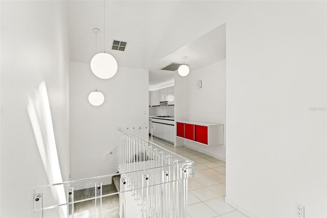 7049 Peninsular Dr, New Port Richey, FL 34652 - staircase with tile patterned floors and baseboards