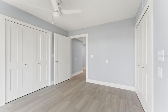 7049 Peninsular Dr, New Port Richey, FL 34652 - unfurnished bedroom with light wood finished floors, a closet, baseboards, and ceiling fan