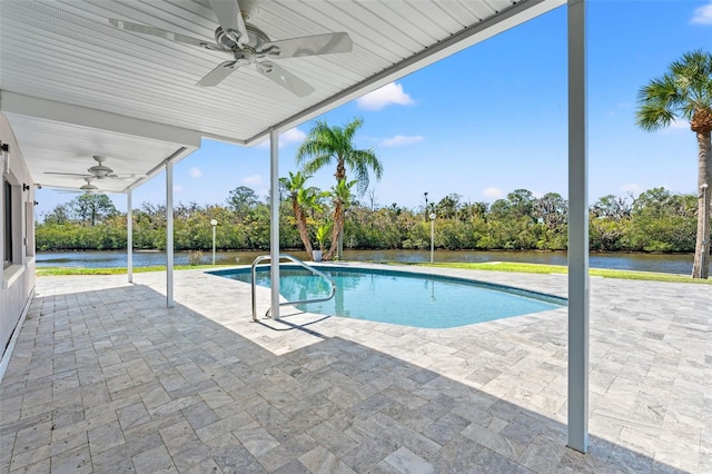 7049 Peninsular Dr, New Port Richey, FL 34652 - outdoor pool with ceiling fan, a patio area, and a water view