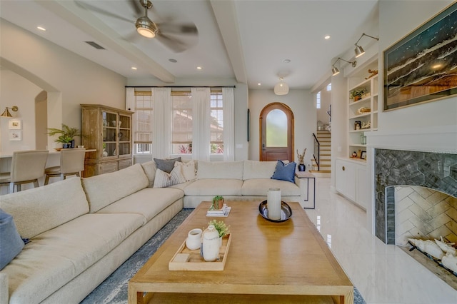 362 41st Ave, St Pete Beach, FL 33706 - tiled living area featuring visible vents, a high end fireplace, arched walkways, and built in features