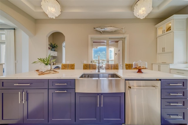 362 41st Ave, St Pete Beach, FL 33706 - kitchen with dishwasher, arched walkways, white cabinetry, a sink, and light stone counters