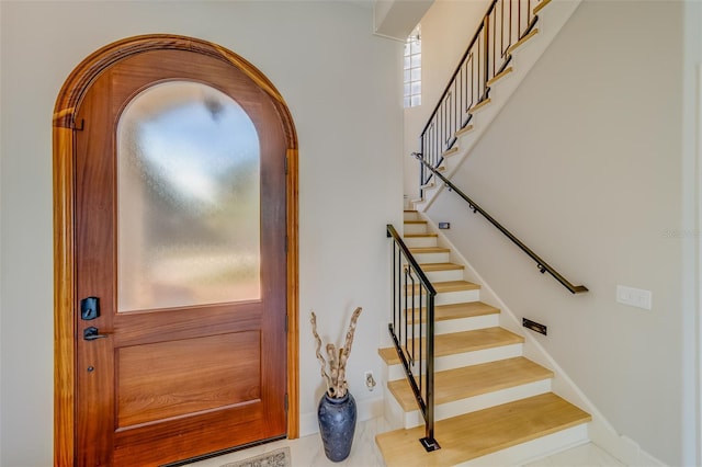 362 41st Ave, St Pete Beach, FL 33706 - interior space with arched walkways, stairs, and baseboards