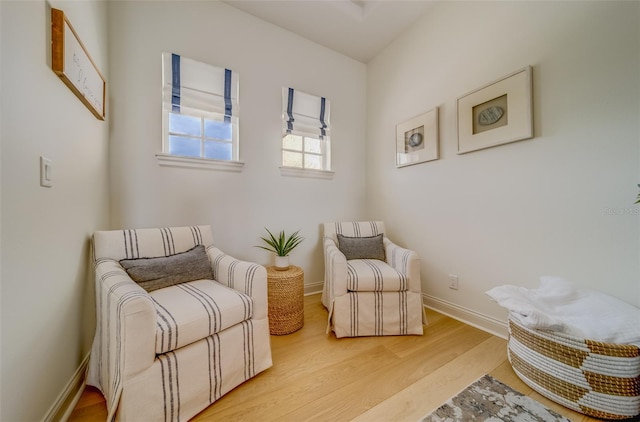 362 41st Ave, St Pete Beach, FL 33706 - sitting room featuring baseboards and light wood-style floors