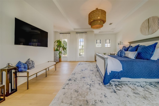 362 41st Ave, St Pete Beach, FL 33706 - bedroom featuring access to exterior, baseboards, visible vents, and light wood-style flooring
