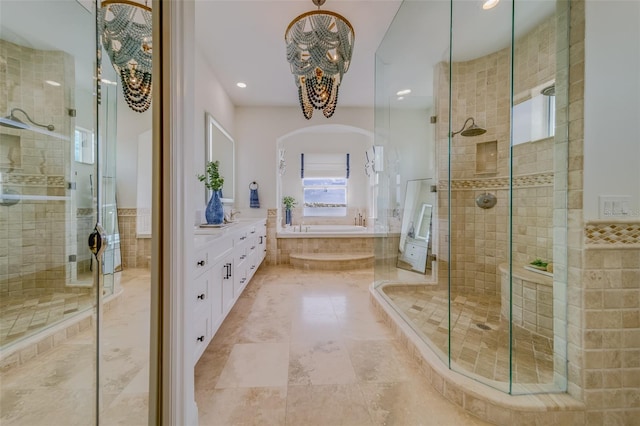 362 41st Ave, St Pete Beach, FL 33706 - full bath featuring a shower stall, a chandelier, and a garden tub
