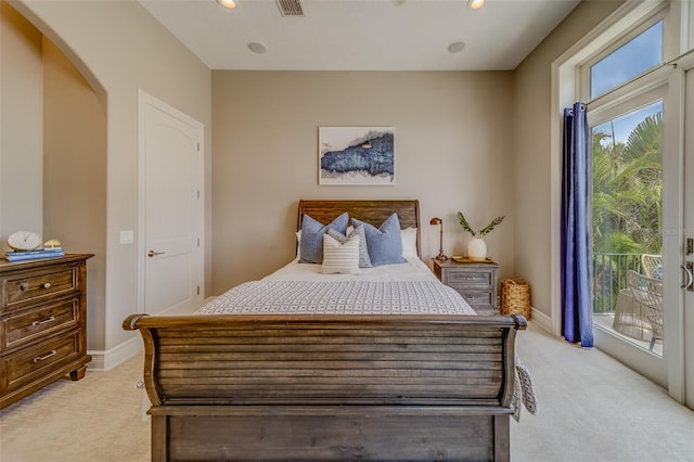 362 41st Ave, St Pete Beach, FL 33706 - bedroom with light carpet, baseboards, access to exterior, and recessed lighting