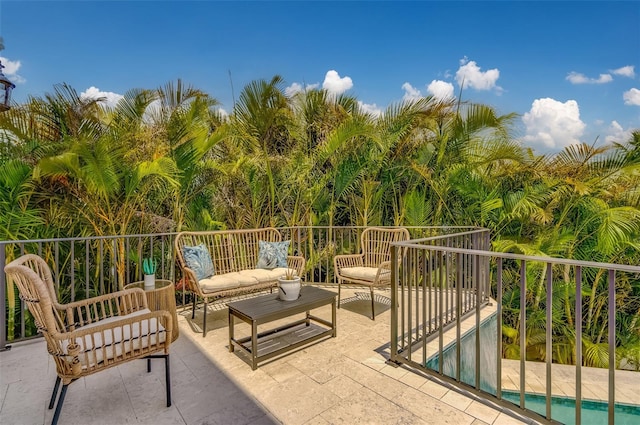 362 41st Ave, St Pete Beach, FL 33706 - view of patio / terrace featuring a balcony and an outdoor hangout area