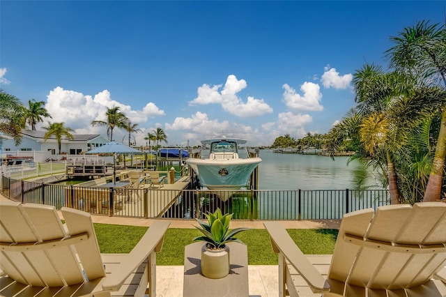 362 41st Ave, St Pete Beach, FL 33706 - exterior space featuring a water view, boat lift, fence, and a boat dock
