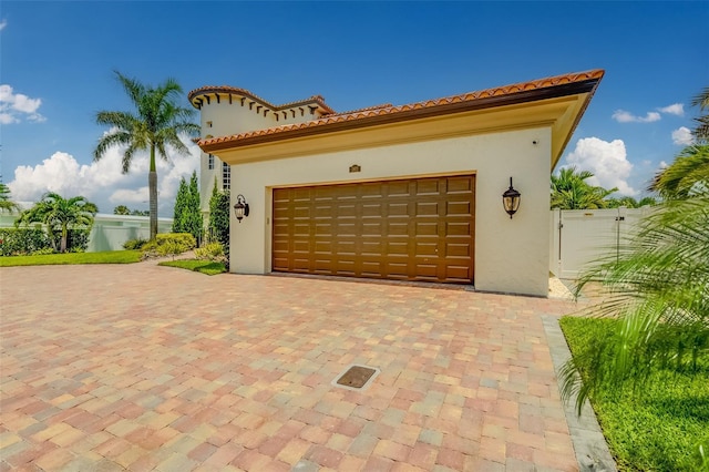 362 41st Ave, St Pete Beach, FL 33706 - garage with decorative driveway and fence