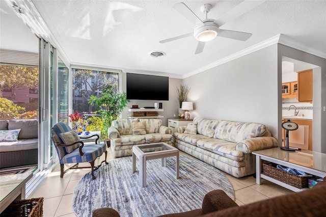 615 10th Ave NE Unit 1, Saint Petersburg, FL 33701 - living area featuring light tile patterned floors, crown molding, a textured ceiling, and visible vents
