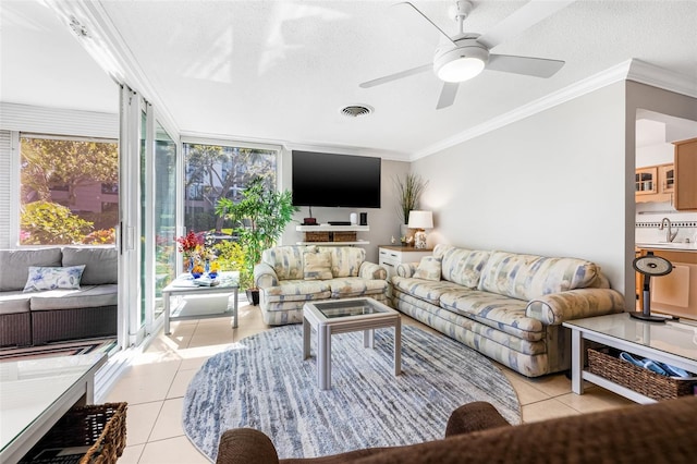 615 10th Ave NE Unit 1, Saint Petersburg, FL 33701 - living room with light tile patterned flooring, crown molding, visible vents, and ceiling fan
