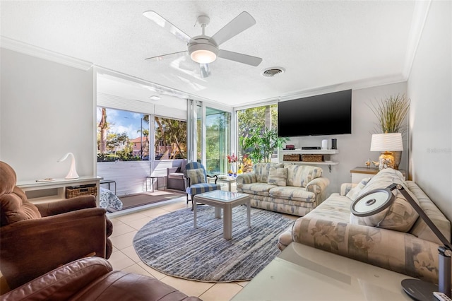 615 10th Ave NE Unit 1, Saint Petersburg, FL 33701 - living area with light tile patterned flooring, expansive windows, a textured ceiling, ceiling fan, and ornamental molding