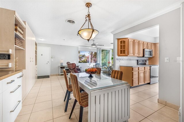 615 10th Ave NE Unit 1, Saint Petersburg, FL 33701 - dining space featuring baseboards, visible vents, ceiling fan, and light tile patterned floors