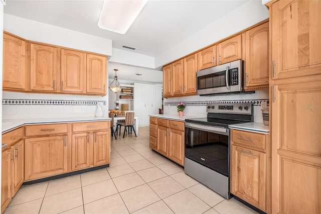 615 10th Ave NE Unit 1, Saint Petersburg, FL 33701 - kitchen with light countertops, appliances with stainless steel finishes, and visible vents