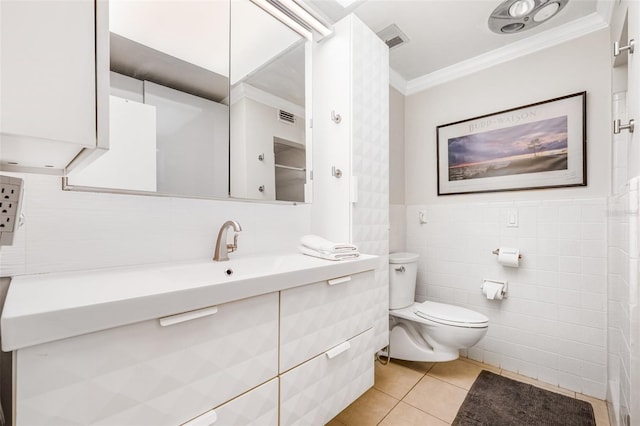 615 10th Ave NE Unit 1, Saint Petersburg, FL 33701 - bathroom with visible vents, ornamental molding, toilet, vanity, and tile patterned flooring