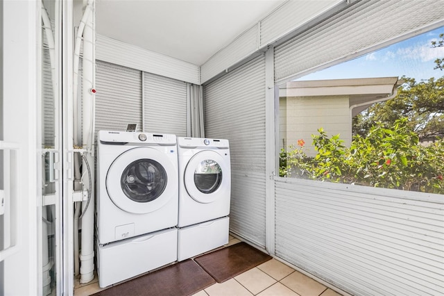 615 10th Ave NE Unit 1, Saint Petersburg, FL 33701 - clothes washing area with tile patterned flooring, washer and clothes dryer, and laundry area