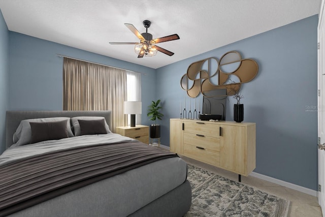 bedroom with baseboards and ceiling fan