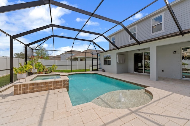 view of pool with glass enclosure, a patio area, a fenced in pool, and an in ground hot tub