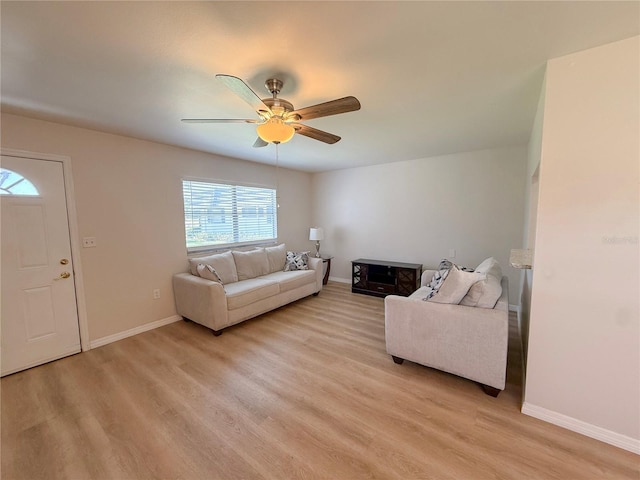 205 Andover Pl N Unit 110, Sun City Center, FL 33573 - living room with a ceiling fan, light wood-type flooring, and baseboards