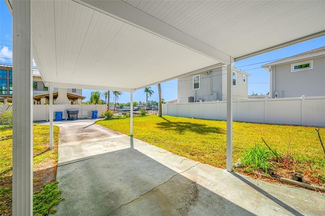 2827 1st St NE, Saint Petersburg, FL 33704 - view of patio with fence and a carport