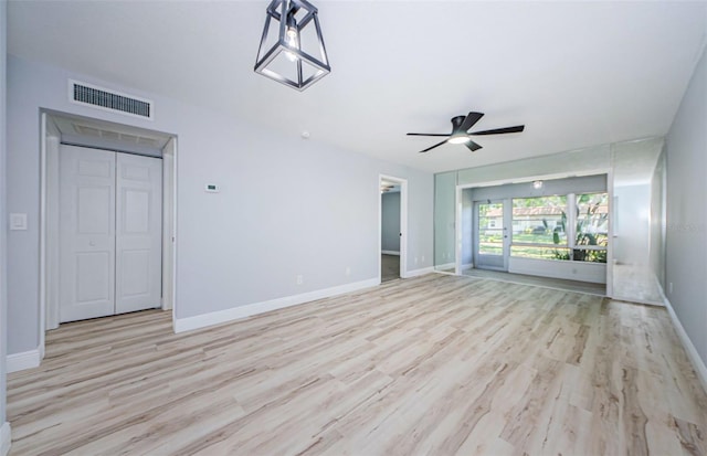 3143 Mission Grove Dr, Palm Harbor, FL 34684 - interior space featuring light wood finished floors, visible vents, baseboards, and a ceiling fan